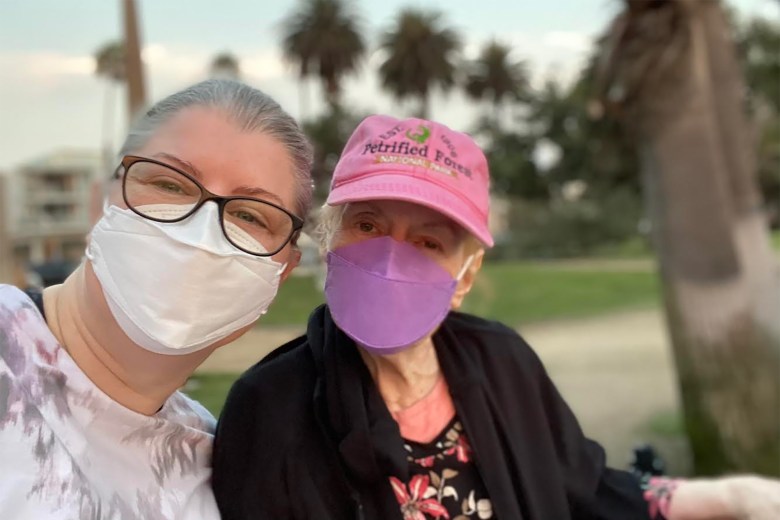 Maitely Weismann visits her 79-year-old mother Celia at her Los Angeles nursing home. Celia narrowly dodged a COVID-19 outbreak at the facility last year, and Weismann is concerned she will contract the more contagious omicron variant. Courtesy of Maitely Weismann