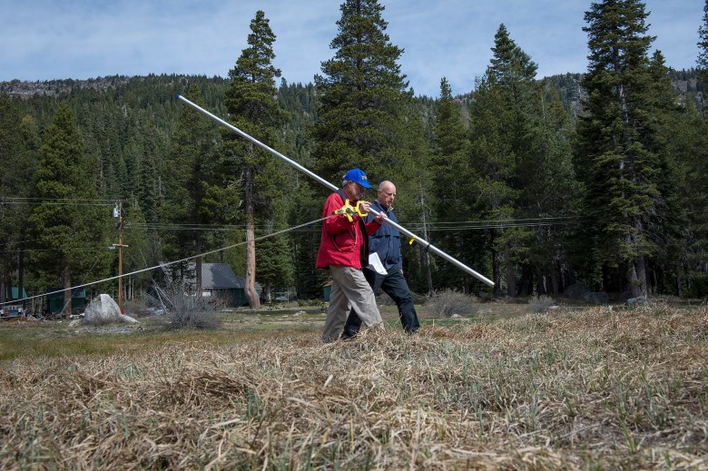 From left, Frank Gehrke, chief of the California Cooperative Snow Surveys Program, and Gov. Edmund G. Brown Jr. joined the Department of Water Resources for a manual snow survey on April 1, 2015. This was the first early-April measurement that found no snow at Phillips, an indication, the Governor said, of the drought's extreme severity. Photo by Kelly M. Grow/California Department of Water Resources