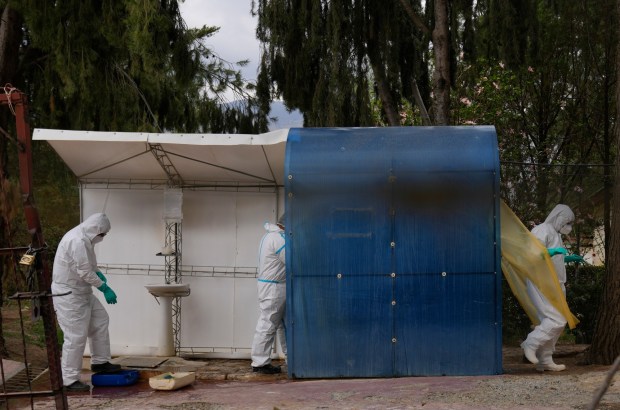 Health workers in protective gear enter a chicken farm during a health alert over a bird flu outbreak in Sacaba, Bolivia, Tuesday, Jan. 31, 2023. Bolivian health authorities reported on Jan. 30 that thousands of birds were culled after an outbreak of bird flu on farms, forcing the declaration of a 120-day health emergency. (AP Photo/Juan Karita)