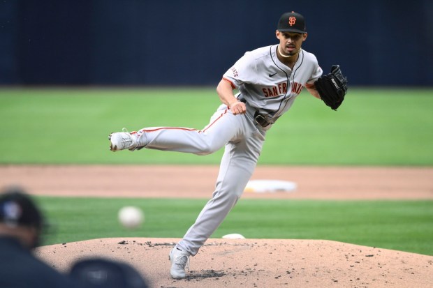 San Francisco Giants starting pitcher Jordan Hicks delivers during the first inning of a baseball game against the San Diego Padres, Saturday, March 30, 2024, in San Diego. (AP Photo/Denis Poroy)