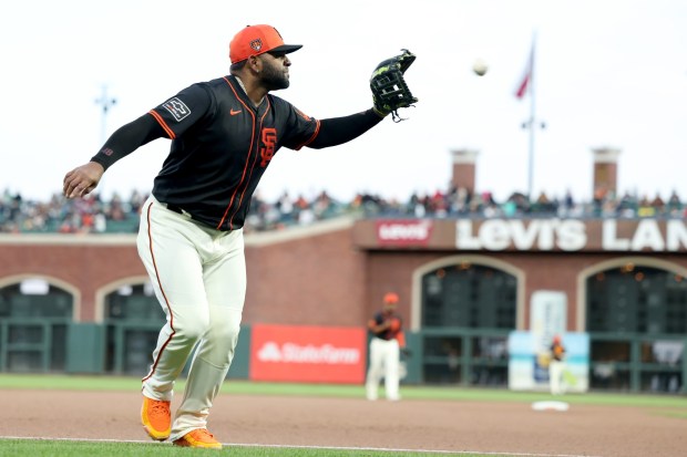 San Francisco Giants Pablo Sandoval gets the ball at the end of the in the eighth inning of Game 2 of the Bay Bridge series against the Oakland Athletics at Oracle Park in San Francisco, Calif., on Tuesday, March 26, 2023. (Ray Chavez/Bay Area News Group)