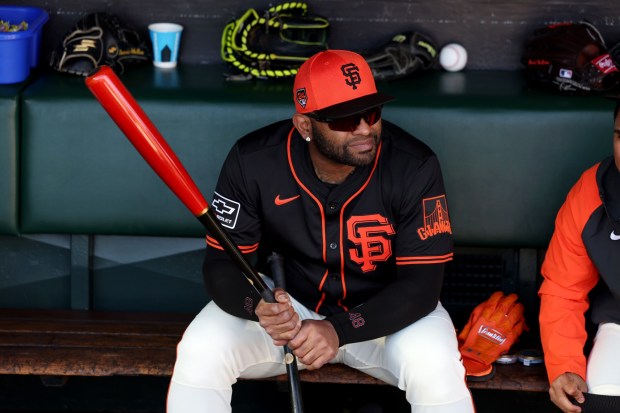 San Francisco Giants Pablo Sandoval looks on with his bat in the dugout before the start of Game 2 of the Bay Bridge series against the Oakland Athletics at Oracle Park in San Francisco, Calif., on Tuesday, March 26, 2023. (Ray Chavez/Bay Area News Group)