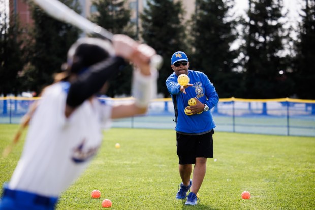 Mt. Eden High School softball head coach Derrick Blue throws practice balls before a game on Thursday, March 28, 2024, in San Leandro, Calif. (Dai Sugano/Bay Area News Group)
