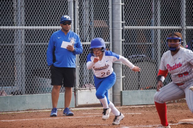 Mt. Eden High School softball head coach Derrick Blue directs a player during a game on Thursday, March 28, 2024, in San Leandro, Calif. (Dai Sugano/Bay Area News Group)