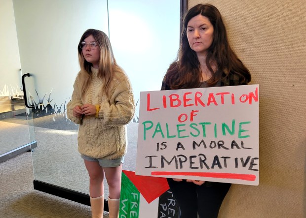Elizabeth Martin, right, and daughter Stella Pertis, 13, await the start of the City Council meeting Tuesday, March 19, 2024, in Chico, California. (Evan Tuchinsky/Enterprise-Record)