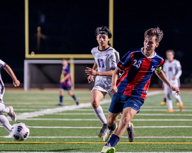 Las Plumas' Roman Stutz (23) scores a goal as Oroville's Tyler Thao (17) gives chase on Thursday, Jan. 25, 2024 at Harrison Stadium in Oroville, California. Stutz had two goals in the Thunderbirds' 6-0 victory. (Ben Mota, All Axis Sports/Contributed)