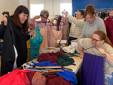 Quota Club of Oroville and Youth for Change volunteers. left to right, Marianne Crabtree, Jody Thompson, Karen Eley, Jane Malloy and Terri Coutolenc are all smiles Monday, March 20, 2023 in Oroville, California as they sort through the formal dresses donated for the 18th Annual Project. (Kyra Gottesman/Mercury-Register)