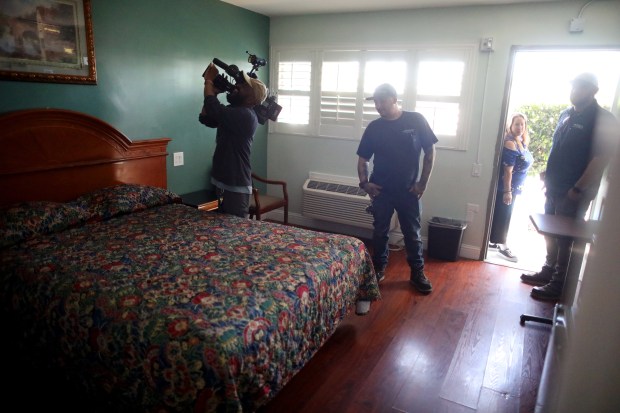 Visitors look over a bedroom at the Executive Inn on Thursday, April 27, 2023, in Antioch, Calif. A maximum of 45 people can be housed at the inn, with the typical stay expected to be 120 to 180 days in the transitional housing project. (Photo: Aric Crabb/Bay Area News Group)