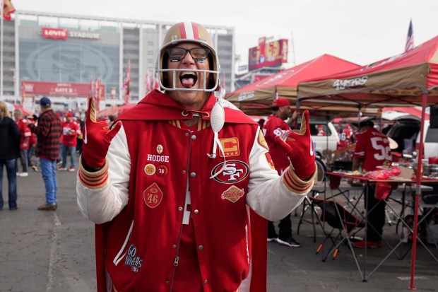 Fans tailgate at Levi's Stadium before the NFL NFC Championship football game between the San Francisco 49ers and the Green Bay Packers Sunday, Jan. 19, 2020, in Santa Clara, Calif. (AP Photo/Tony Avelar)