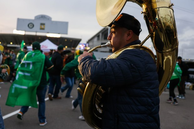 Samuel Garcia along with a Mexican band perform as Oakland Athletics fans dance during the boycott opening day block party in the parking lot during their MLB opening day game against the Cleveland Guardians at the Coliseum in Oakland, Calif., on Thursday, March 28, 2024. (Ray Chavez/Bay Area News Group)