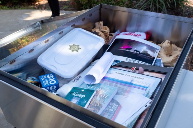 Literature, art, momentos, figures and other items are set on display inside a time capsule Wednesday, Nov. 8, 2023 at Paradise Community Park in Paradise, California. (Michael Weber/Enterprise-Record)